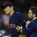 Aug 7, 2015; Detroit, MI, USA; Boston Red Sox relief pitcher Koji Uehara (19) is helped off the field by a trainer after the game against the Detroit Tigers at Comerica Park. Boston won 7-2. Mandatory Credit: Rick Osentoski-USA TODAY Sports