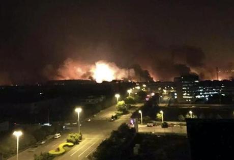 Smoke and fire erupted into the night sky after an explosion in Tianjin, China.
