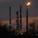 Dusk fell on the Exxon Mobil refinery in St. bernard Parish, Louisiana, in February. The price of oil tumbled to its lowest level in more than six years.