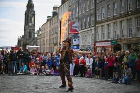 Fringe entertainers on the city?s Royal Mile in 2014.
