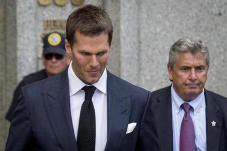New England Patriots quarterback Tom Brady exits the Manhattan Federal Courthouse in New York August 12, 2015. A federal judge on Wednesday fired tough questions at a National Football League lawyer about whether Brady's four-game 