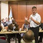 Mayor Martin J. Walsh spoke to clergy members at police headquarters during a meeting on gun violence.