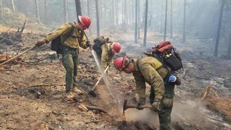 Firefighters from Massachusetts help put out flames in the Oregon this week.
