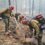 Firefighters from Massachusetts help put out flames in the Oregon this week.