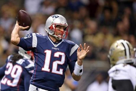 Aug 22, 2015; New Orleans, LA, USA; New England Patriots quarterback Tom Brady (12) makes a throw against the New Orleans Saints at Mercedes-Benz Superdome. Mandatory Credit: Chuck Cook-USA TODAY Sports
