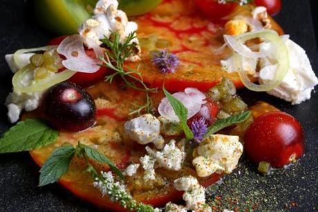 Tomato salad with sea salt-spiked feta and popped kernels of corn at Shepard Restaurant.
