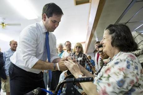 Marco Rubio spoke to Marie Kenneally during a town hall meeting in Littleton, N.H., on Wednesday. 
