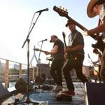 Caveman performed at Lovejoy Wharf, on top the Converse headquarters on Wednesday.