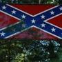The Confederate flag was erected about five years ago by a 1969 Walpole High graduate whose property abuts Turco Field.