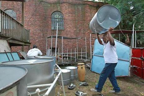 Carl Smith of the Branches Steel Orchestra worked with his drums in preparation for the festivities.
