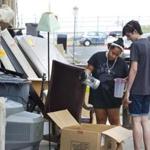 Damaris Swass (left) and Tyler Villa, students at The School of the Museum of Fine Arts, sifted through discarded items on Linden Street in Allston on Monday, but didn?t find much of use.