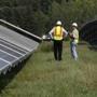 Two solar farms alongside the Mass. Pike contain 2,100 panels each.