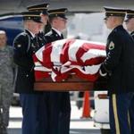 Members of the New Hampshire Army National Guard Honor Guard carried the remains of Korean War veteran Army Sgt. Christopher Vars at Logan Airport in Boston.