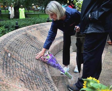 Faye Kane placed flowers and remembered her daughter, Jennifer, during a 9/11 wreath laying ceremony at Boston Pubic Garden.
