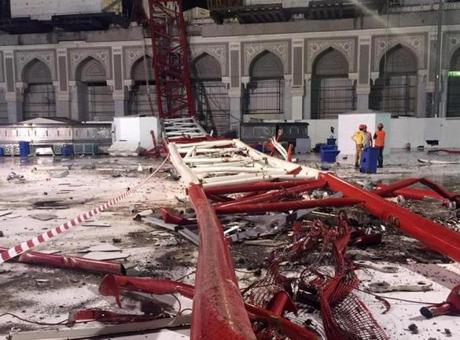 Saudi emergency teams stood next to a construction crane after it crashed into the Grand Mosque.
