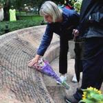 Faye Kane placed flowers and remembered her daughter, Jennifer, during a 9/11 wreath laying ceremony at Boston Pubic Garden.