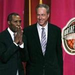 Basketball Hall of Fame inductee Jo Jo White pauses to acknowledge applause during the enshrinement ceremony for the Class of 2015 of the Naismith Memorial Basketball Hall of Fame in Springfield, Mass., Friday, Sept. 11, 2015. At right is White's Boston Celtics teammate, Hall of Famer Dave Cowens. (AP Photo/Charles Krupa)