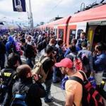 Refugees boarded chartered trains after hey arrived in Munich, Germany, on Sunday.