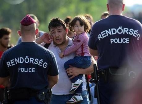 A migrant father and his daughter asked for  permission to enter into Hungary near Roszke as the border fence with Serbia was closed by Hungarian police. 

