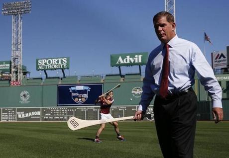 Mayor Martin J. Walsh took a crack at hurling with Galway team member David Collins.
