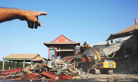 Saugus, MA 091615 Worker pointed to an air conditioning unit as demolition began on the former Weylus at 7am today on Route 1 in Saugus, Wednesday, September 16 2015. According to owner, Anthony Dinanno (cq), the work will continue for about a week. (Globe Staff/Wendy Maeda) section: Business slug: 17Weylus reporter: In-Cap
