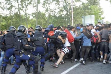 Hungarian riot police charged migrants at the border crossing with Serbia in Roszke, Hungary, on Wednesday.
