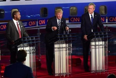 Republican presidential hopefuls Ben Carson (left), Donald Trump (center) and Jeb Bush participated in the Republican presidential debate. 
