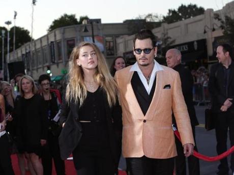 Three-time Oscar nominee Johnny Depp and wife Amber Heard arrived for Tuesday?s special screening.
