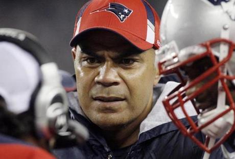 FILE - In this Nov. 22, 2009, file photo, New England Patriots linebacker Junior Seau, center, talks to teammates on the sidelined during an NFL football game against the New York Jets in Foxborough, Mass. A federal judge has approved Wednesday, April 22, 2015, a plan to resolve thousands of NFL concussion lawsuits that could cost the league $1 billion over 65 years. Critics contend the NFL is getting off lightly given annual revenues of about $10 billion About 200 NFL retirees or their families, including Seau's, have rejected the settlement and plan to sue the league individually. (AP Photo/Elise Amendola, File)
