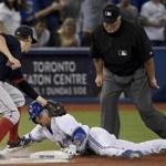 Toronto Blue Jays shortstop Ryan Goins slid into third with a triple during the fourth inning. 