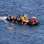 A dinghy overcrowded by migrants drifts after its engine broke down whille crossing the Aegean Sea from Turkey to the Greek island of Lesbos on Sunday. 