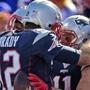 Patriots quarterback Tom Brady (left) and wide receiver Julian Edelman celebrated after a third-quarter touchdown.