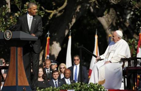 Obama looked at Pope Francis while delivering remarks at the White House.
