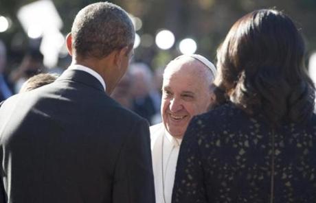  Francis smiled as he was greeted by the Obamas.
