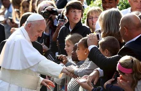 Francis greeted schoolchildren after leaving the Vatican Embassy.
