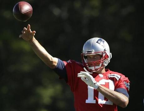 New England Patriots quarterback Tom Brady throws a pass during NFL football practice, Wednesday, Sept. 23, 2015, in Foxborough, Mass. (AP Photo/Steven Senne)

