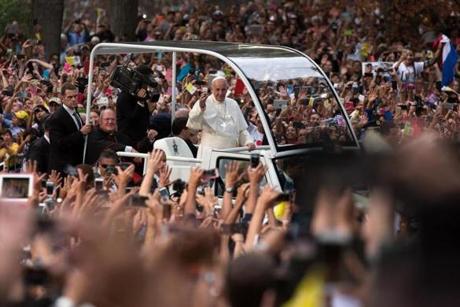Pope Francis waved as his motorcade drove through Central Park. Below, he celebrated a grand Mass at Madison Square Garden. At right, the pope spoke to  world leaders at the United Nations, urging them to wipe out global struggles.
