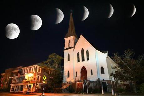 Plymouth- 09/27/15 - A rare supermoon total eclipse photographed in a multiple exposure at 10 minute intervals over an hour time starting at 9:07 p.m. pictured above the Church of St. Peter on Court Street in Plymouth. Boston Globe staff photo by (metro)
