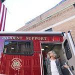 Kathy Crosby-Bell ? mother of Firefighter Michael Kennedy, who died in the 2014 Back Bay fire ? spoke at the dedication of a support vehicle for the Boston Sparks Association near the Boston Fire Museum.