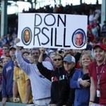 Boston, Massachusetts -- 9/27/2015-- Fans hold a sign as a tribute to Don Orsillo at the conclusion of the game between the Red Sox and Orioles at Fenway Park in Boston, Massachusetts September 27, 2015. Jessica Rinaldi/Globe Staff Topic: Redsox-Orioles Reporter: 