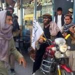 A Taliban fighter adorned his motorcycle with a Taliban flag on Tuesday in the northern Afghanistan city of Kunduz, which was seized Monday.  