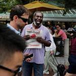Gregory Daugherty selling copies of Spare Change News at Forbes Plaza in Harvard Square in August. 