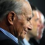 Boston- 10/01/15 - The Boston Bruins held a practice at TD Garden before their Media Day there. Owner Jeremy Jacobs listens to Cam Neely speak as he sits with Don Sweeney and Claude Julien during a press availability. Boston Globe staff photo by John Tlumacki(sports)