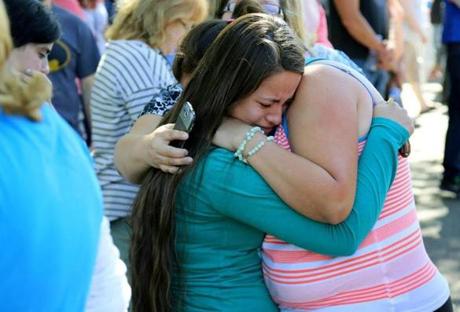 Jessica Vazquez (left) hugged her aunt, Leticia Acaraz, as they await word on Acaraz's daughter after a shooting at Umpqua Community College in Roseburg, Ore.
