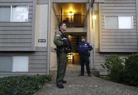 Police stood guard outside the apartment building where alleged Umpqua Community College gunman Chris Harper Mercer lived in Roseburg, Oregon, on Friday.
