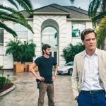 Michael Shannon (fore-ground) and Andrew Garfield star in ?99 Homes.?