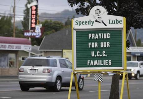 A sign in remembrance of those killed at Umpqua Community College was displayed at a local business in Roseburg, Ore.
