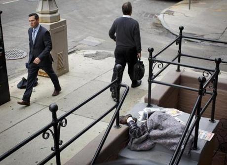 A homeless person slept on the steps of a business on a bustling Berkeley Street last Thursday morning.
