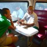 Lee and Richard Drugan of Bourne played cards on the 10:05 a.m. train before it headed out of the commuter rail station in Kingston ? and then to Plymouth.