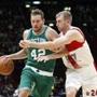 Boston Celtics' David Lee, left, drives as Olimpia Milano's Robbie Hummel challenges him, during their basketball match, part of the NBA global games, in Assago, near Milan, Italy, Tuesday, Oct. 6, 2015. (AP Photo/Antonio Calanni)
